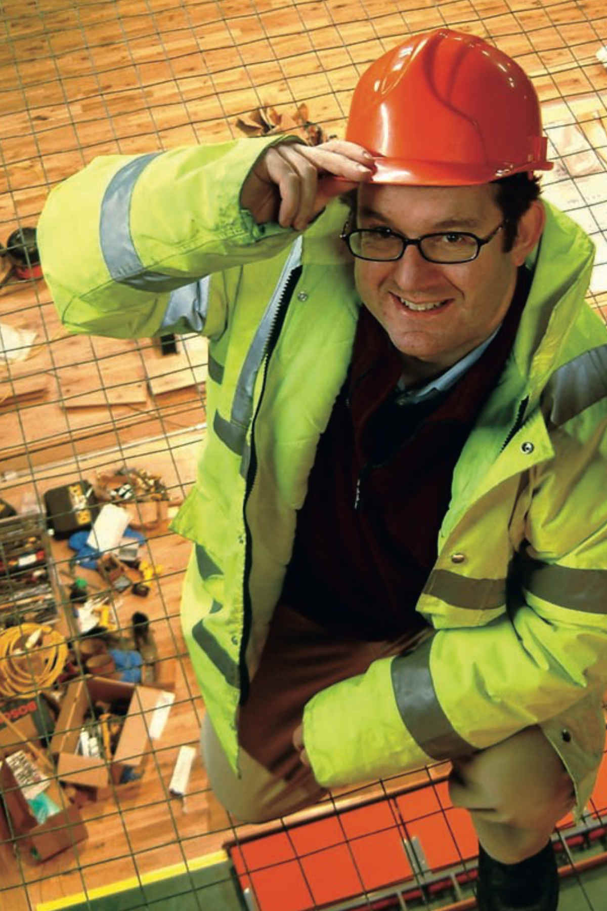 man in hard hat above auditorium